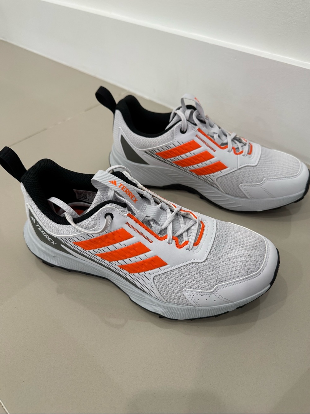 Adidas Men's White Athletic Shoes with Orange Accents